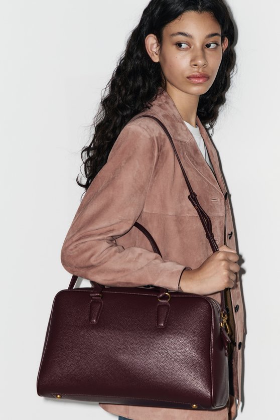 Bag with a keychain charm — image 1