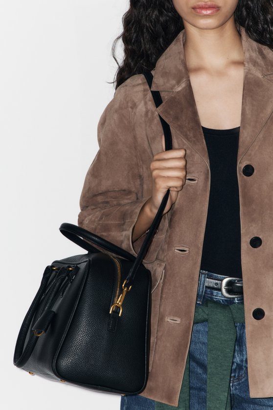 Bag with a keychain charm — image 1